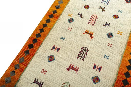Backside of handmade 2000s Persian Gabbeh rug showing knot structure and weave density