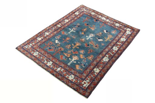 Corner detail of 2000s Persian Gabbeh rug showing border pattern and Wool pile