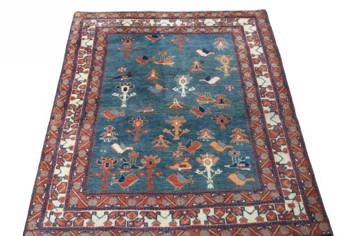 Surface texture of 2000s Persian Gabbeh rug with natural Wool and intricate pattern