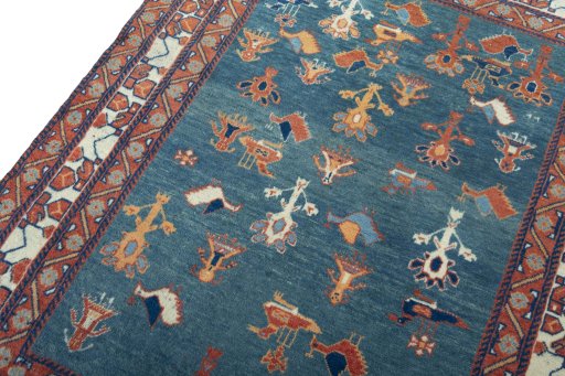 Backside of handmade 2000s Persian Gabbeh rug showing knot structure and weave density