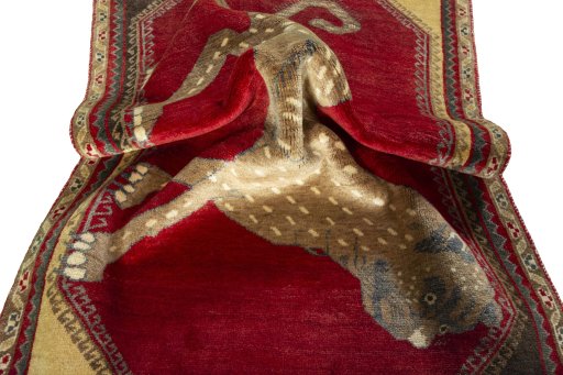 Corner detail of 2000s Persian Gabbeh rug showing border pattern and Wool pile