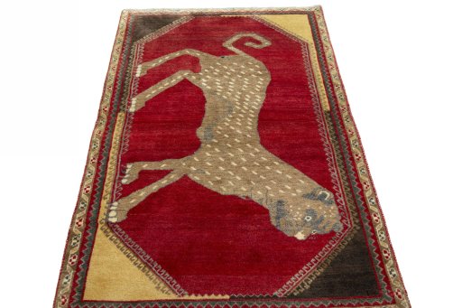 Surface texture of 2000s Persian Gabbeh rug with natural Wool and intricate pattern