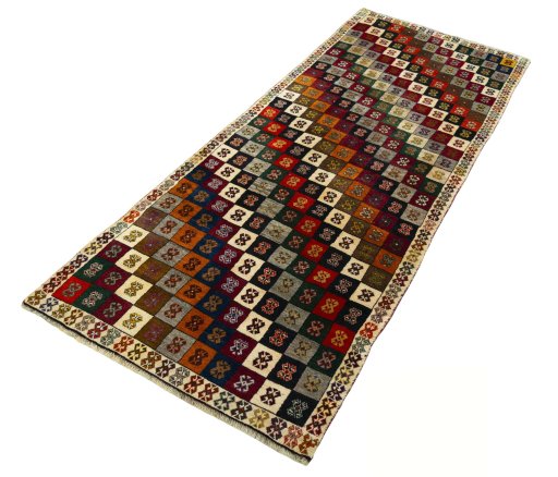 Corner detail of 2000s Persian Gabbeh rug showing border pattern and Wool pile