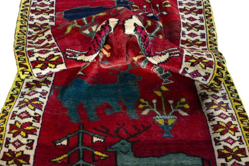 Corner detail of 2000s Persian Gabbeh rug showing border pattern and Wool pile