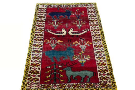 Surface texture of 2000s Persian Gabbeh rug with natural Wool and intricate pattern
