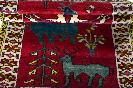 Full view of 2000s Persian Gabbeh rug from Iran / Persia, 177 × 110 cm in Red tones