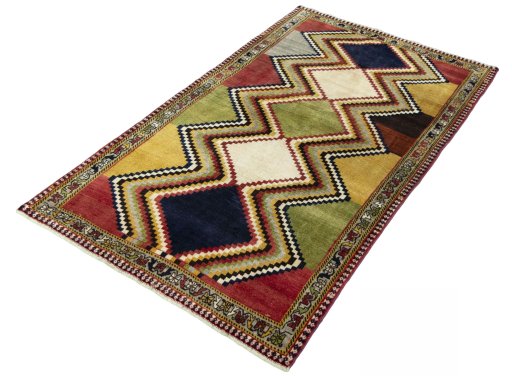 Corner detail of 2000s Persian Gabbeh rug showing border pattern and Wool pile