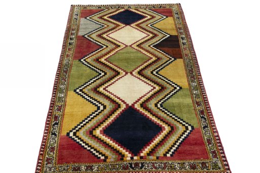 Surface texture of 2000s Persian Gabbeh rug with natural Wool and intricate pattern