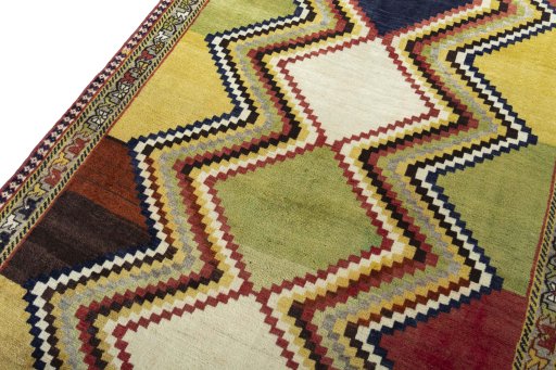 Backside of handmade 2000s Persian Gabbeh rug showing knot structure and weave density