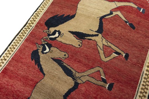 Backside of handmade 2000s Persian Gabbeh rug showing knot structure and weave density