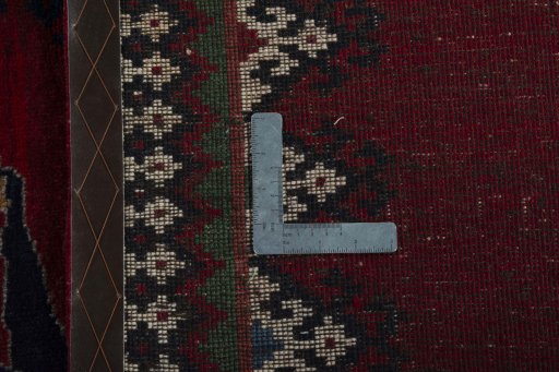 Surface texture of 2000s Persian Gabbeh rug with natural Wool and intricate pattern