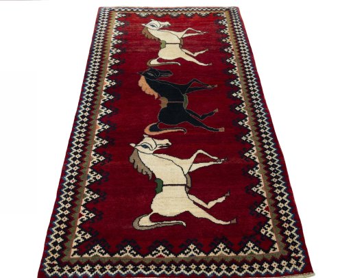 Surface texture of 2000s Persian Gabbeh rug with natural Wool and intricate pattern