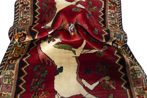 Corner detail of 2000s Persian Gabbeh rug showing border pattern and Wool pile