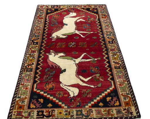 Surface texture of 2000s Persian Gabbeh rug with natural Wool and intricate pattern