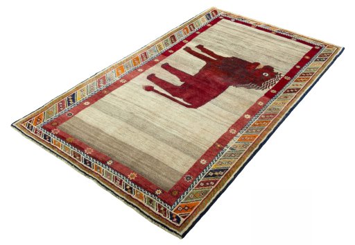 Corner detail of 2000s Persian Gabbeh rug showing border pattern and Wool pile