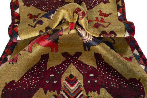 Corner detail of 2000s Persian Gabbeh rug showing border pattern and Wool pile