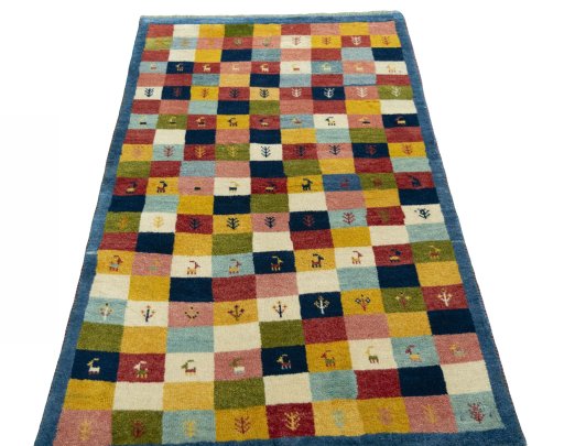 Surface texture of 2000s Persian Gabbeh rug with natural Wool and intricate pattern