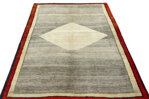 Surface texture of 2000s Persian Gabbeh rug with natural Wool and intricate pattern