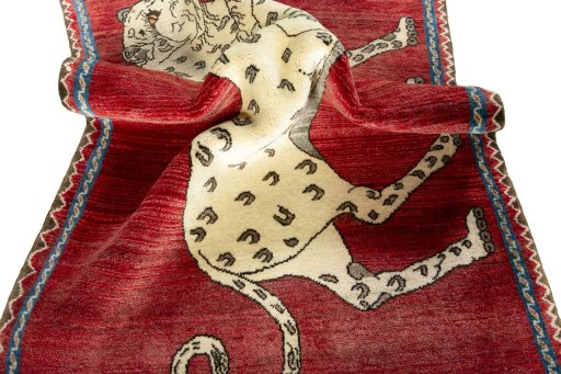Corner detail of 2000s Persian Gabbeh rug showing border pattern and Wool pile