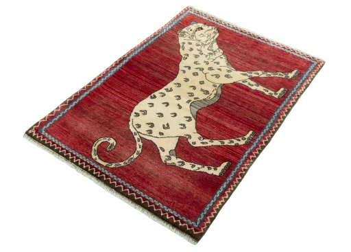 Corner detail of 2000s Persian Gabbeh rug showing border pattern and Wool pile
