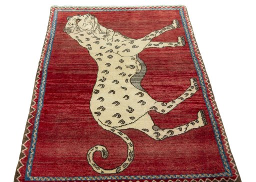 Surface texture of 2000s Persian Gabbeh rug with natural Wool and intricate pattern