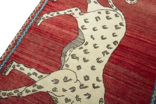 Backside of handmade 2000s Persian Gabbeh rug showing knot structure and weave density
