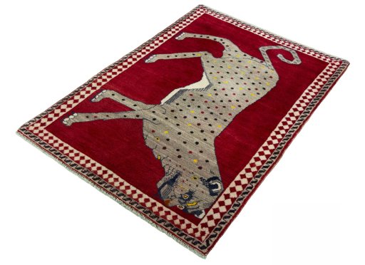 Corner detail of 2000s Persian Gabbeh rug showing border pattern and Wool pile