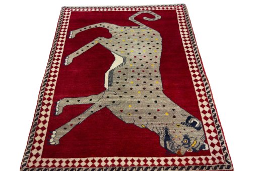 Surface texture of 2000s Persian Gabbeh rug with natural Wool and intricate pattern