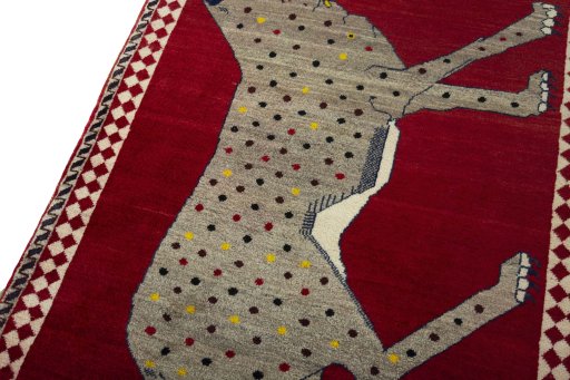 Backside of handmade 2000s Persian Gabbeh rug showing knot structure and weave density