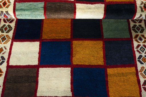 Full view of 2000s Persian Gabbeh rug from Iran / Persia, 195 × 122 cm in Multi Color tones
