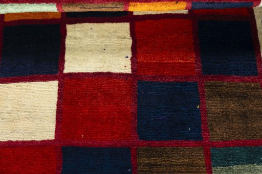 Full view of 2000s Persian Gabbeh rug from Iran / Persia, 175 × 113 cm in Multi Color tones
