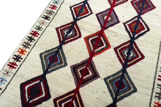 Backside of handmade 2000s Persian Gabbeh rug showing knot structure and weave density