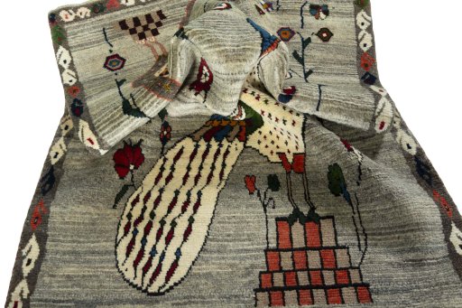 Corner detail of 2000s Persian Gabbeh rug showing border pattern and Wool pile