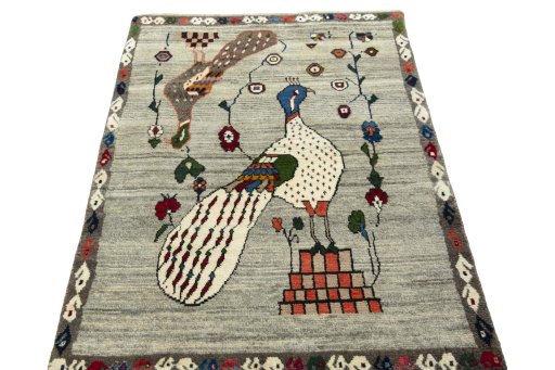 Surface texture of 2000s Persian Gabbeh rug with natural Wool and intricate pattern