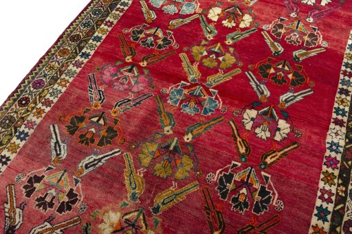 Backside of handmade 2000s Persian Gabbeh rug showing knot structure and weave density