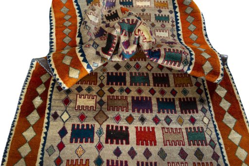Corner detail of 2000s Persian Gabbeh rug showing border pattern and Wool pile