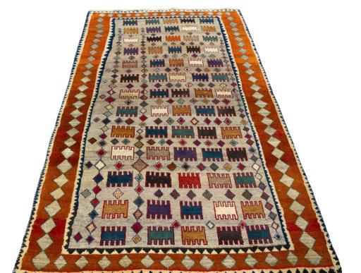 Surface texture of 2000s Persian Gabbeh rug with natural Wool and intricate pattern