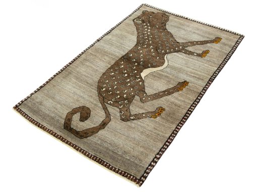 Corner detail of 2000s Persian Gabbeh rug showing border pattern and Wool pile