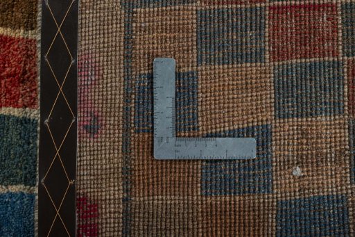 Surface texture of 2000s Persian Gabbeh rug with natural Wool and intricate pattern