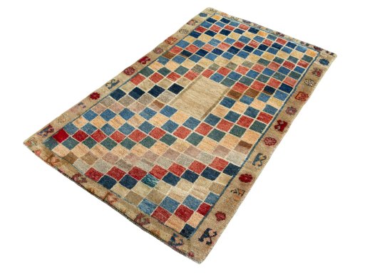 Corner detail of 2000s Persian Gabbeh rug showing border pattern and Wool pile