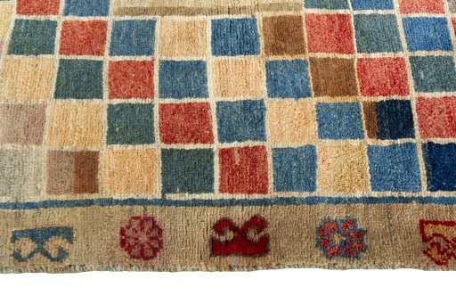 Full view of 2000s Persian Gabbeh rug from Iran / Persia, 170 × 103 cm in Multi Color tones