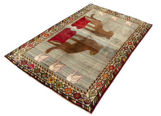 Corner detail of 2000s Persian Gabbeh rug showing border pattern and Wool pile