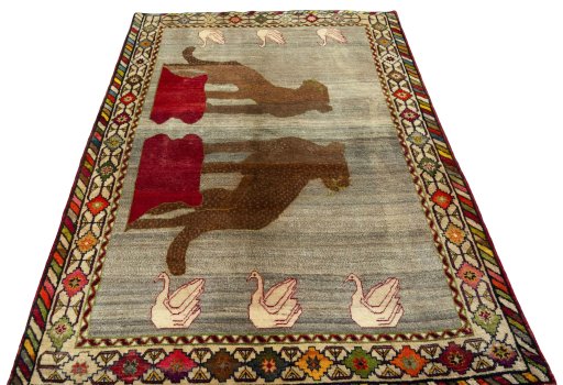 Surface texture of 2000s Persian Gabbeh rug with natural Wool and intricate pattern
