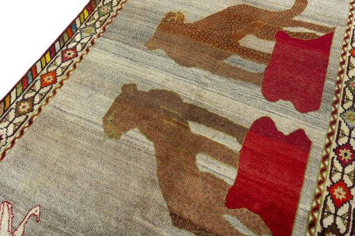 Backside of handmade 2000s Persian Gabbeh rug showing knot structure and weave density