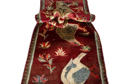 Corner detail of 2000s Persian Gabbeh rug showing border pattern and Wool pile