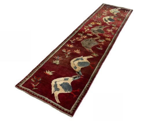 Corner detail of 2000s Persian Gabbeh rug showing border pattern and Wool pile