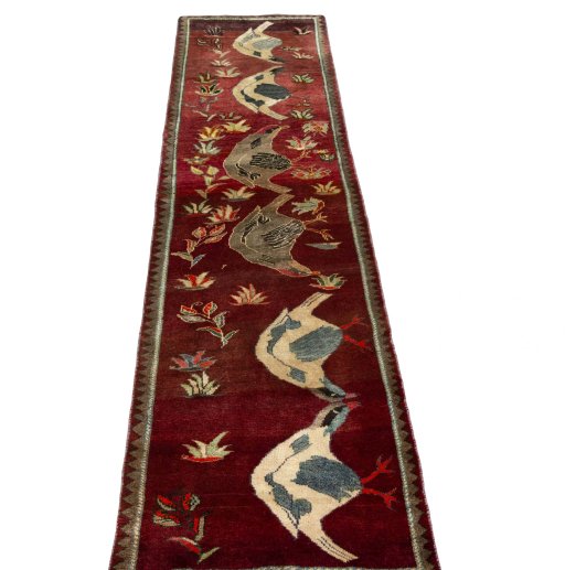 Surface texture of 2000s Persian Gabbeh rug with natural Wool and intricate pattern