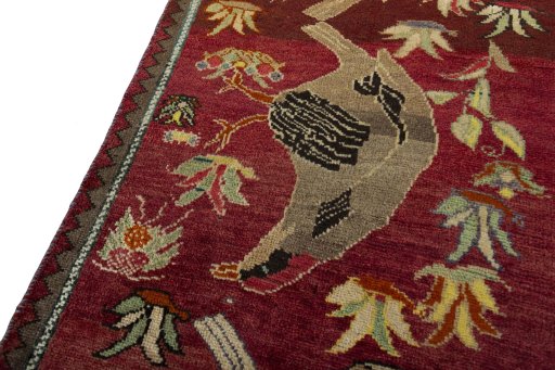 Backside of handmade 2000s Persian Gabbeh rug showing knot structure and weave density
