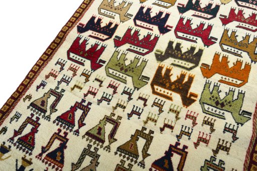 Backside of handmade 2000s Persian Gabbeh rug showing knot structure and weave density