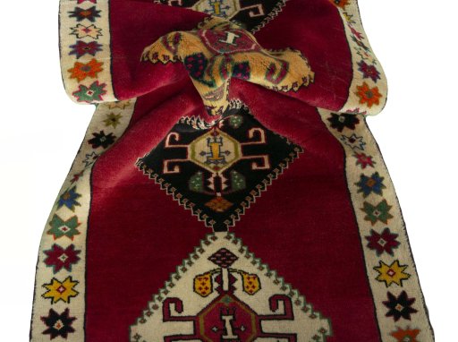 Corner detail of 2000s Persian Gabbeh rug showing border pattern and Wool pile